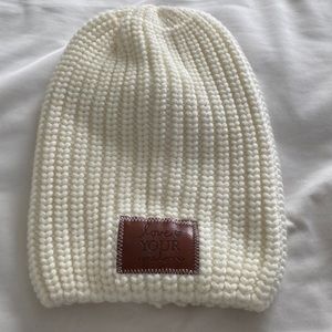 NWOT Love Your Melon hat in cream. One size fits all